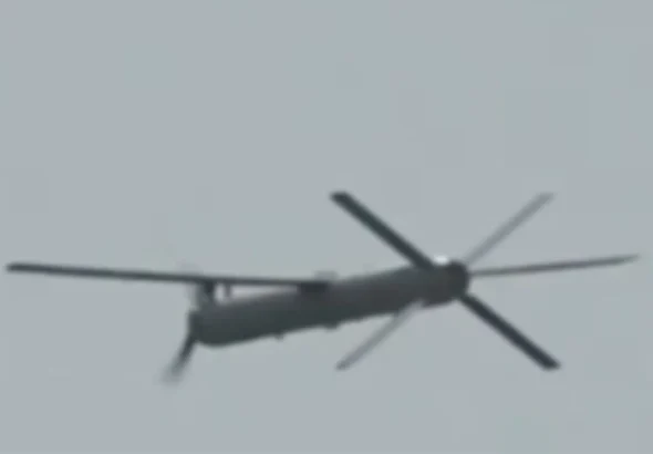 Modified Iranian Shahed-101 drone featuring a nose-mounted electric tractor propeller and X-shaped tail stabilizer
