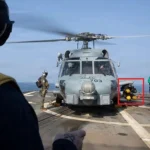 US Navy MH-60R Seahawk helicopter armed with Hellfire missiles operating from USS Delbert D. Black during Operation Epic Fury