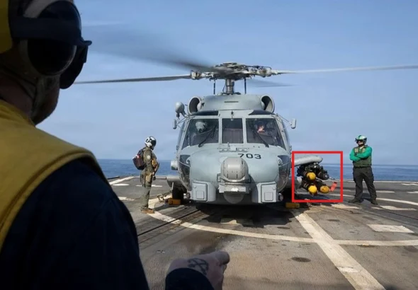 US Navy MH-60R Seahawk helicopter armed with Hellfire missiles operating from USS Delbert D. Black during Operation Epic Fury