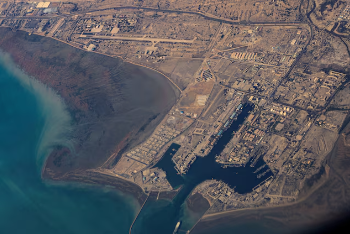 Oil tankers sailing through the Strait of Hormuz as regional conflict disrupts Iraq’s crude exports and global energy supply.